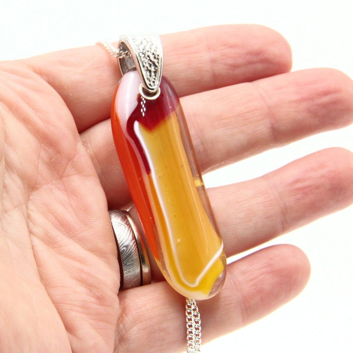 Orange Glass Pendant with Silver Accents