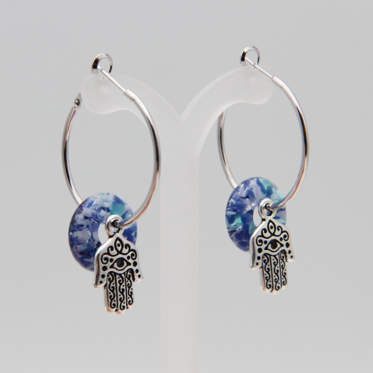 Silver Hoop Earrings with Blue Glass Donuts and Hamsa Hand Charms