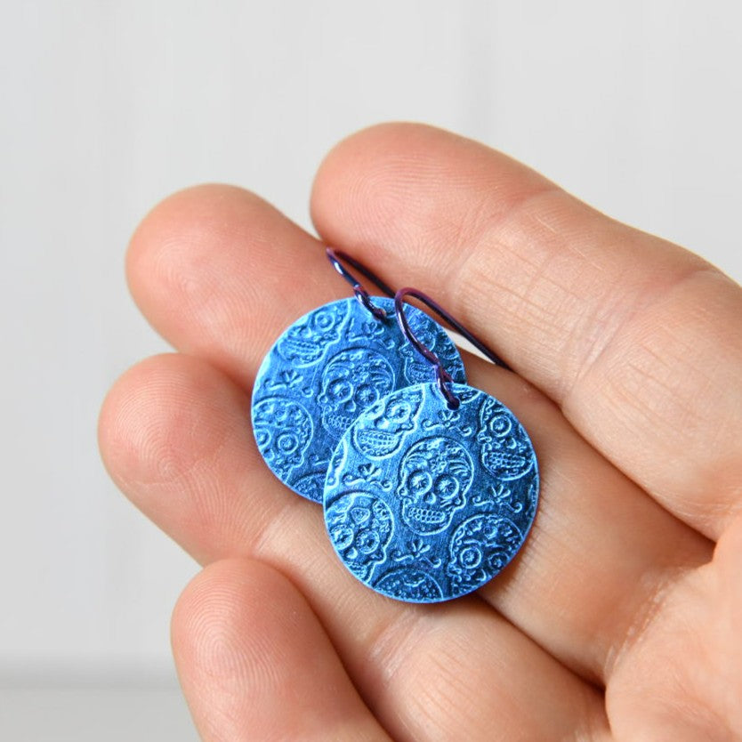 Blue Anodized Niobium Dangle Earrings with Calavera Sugar Skull Pattern