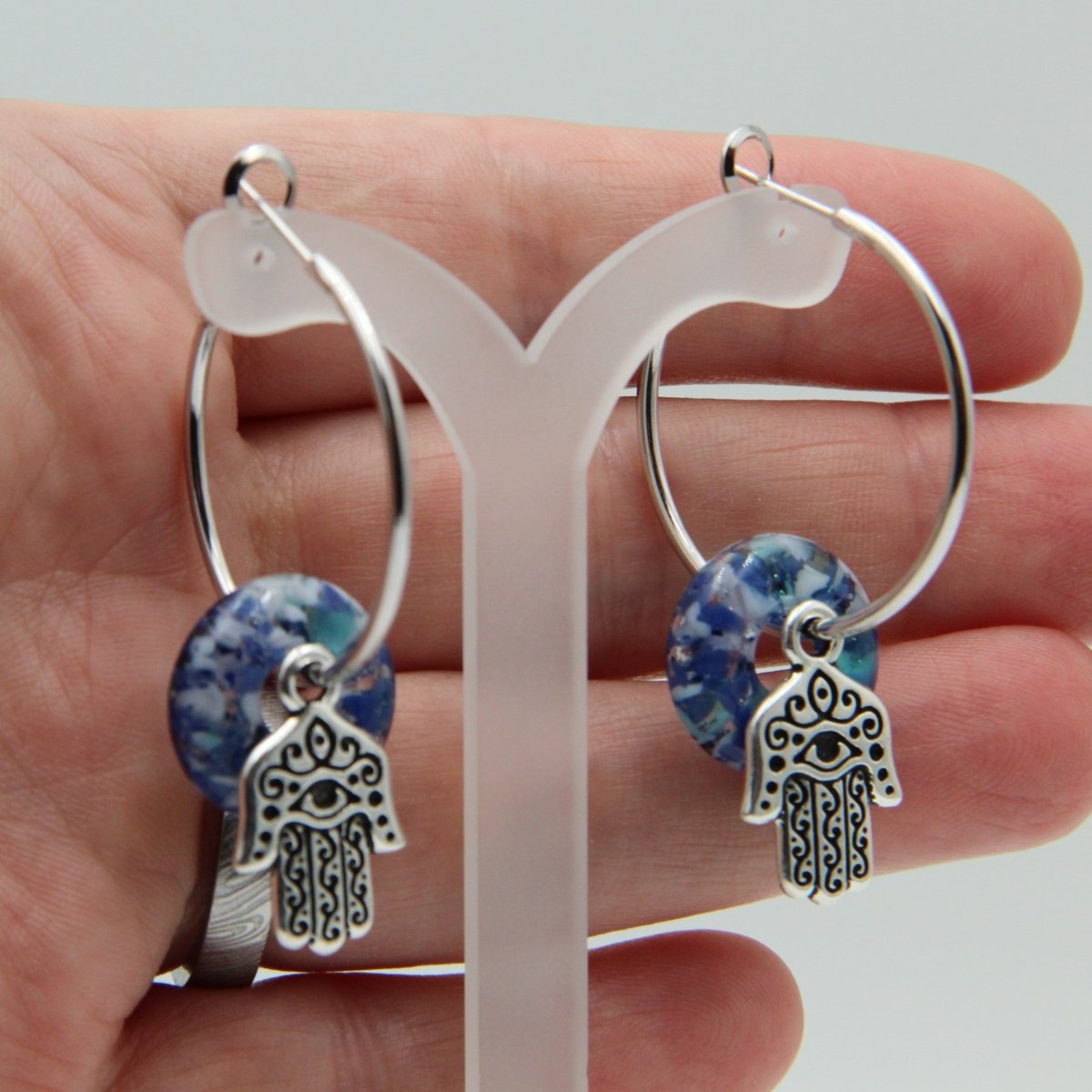 Silver Hoop Earrings with Blue Glass Donuts and Hamsa Hand Charms
